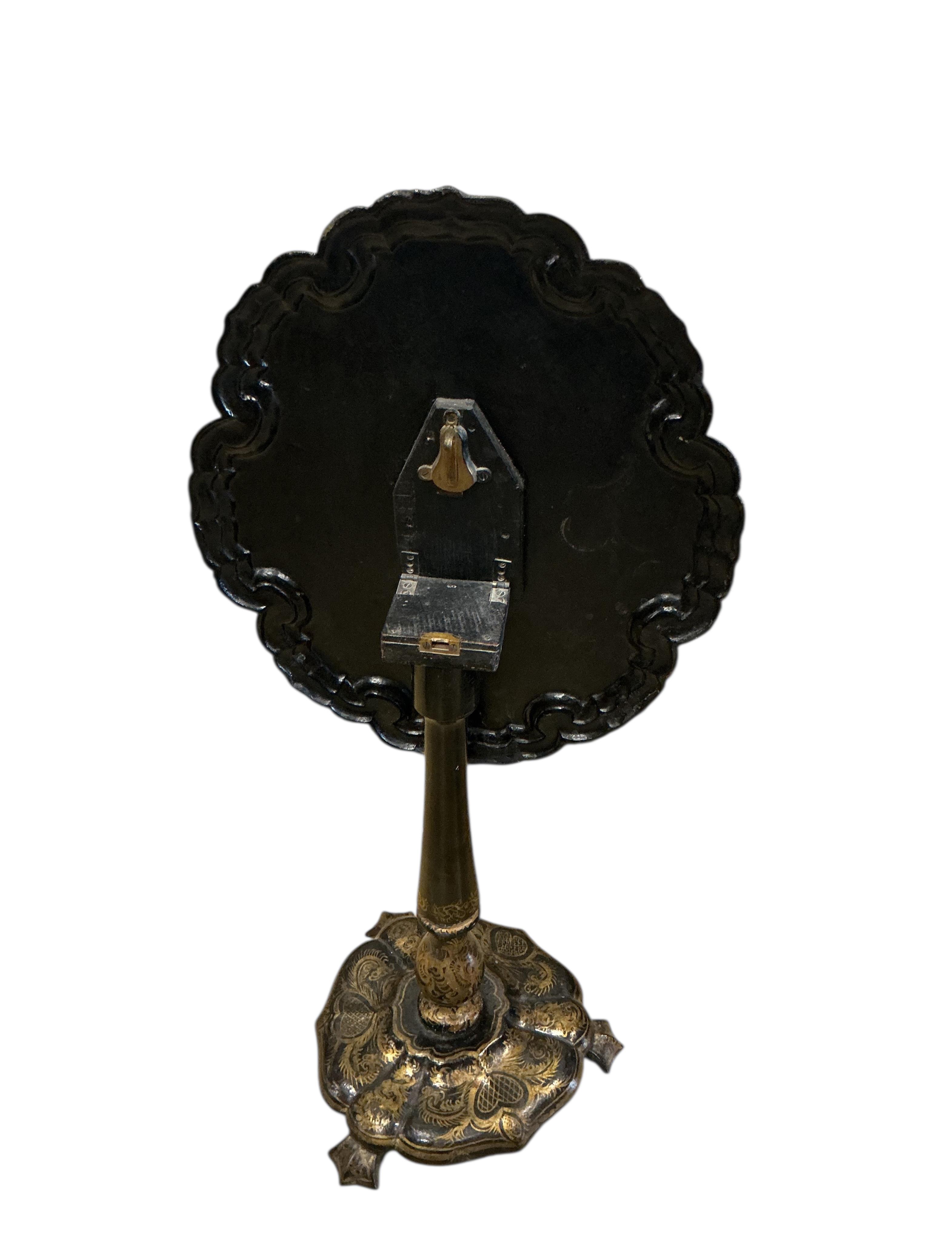 A Victorian mother of pearl inlaid papier-mâché oval tilt top wine table, width 58cm, height 67cm, and a similar cane seat chair
